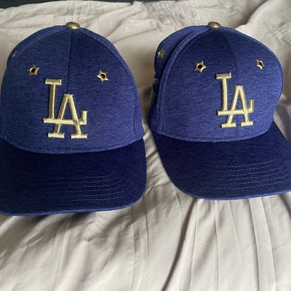 Two blue and gold LA Dodgers hats size youth. Selling individually or together.
